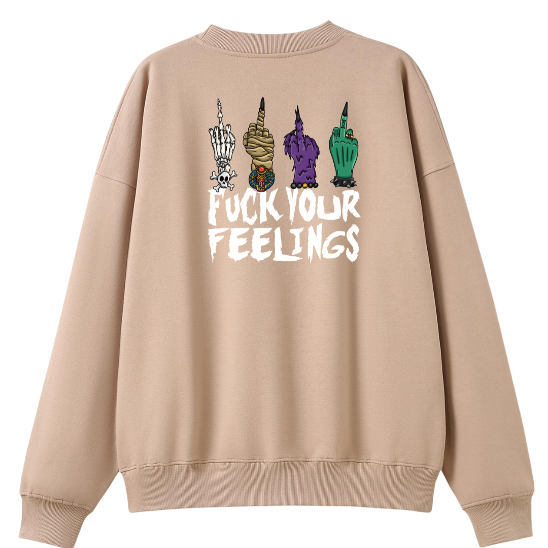 A peach oversized crew neck shown from the back, with the Fuck Your Feelings graphic printed large across the back, skeleton, mummy, werewolf and witch hands flipping the bird.