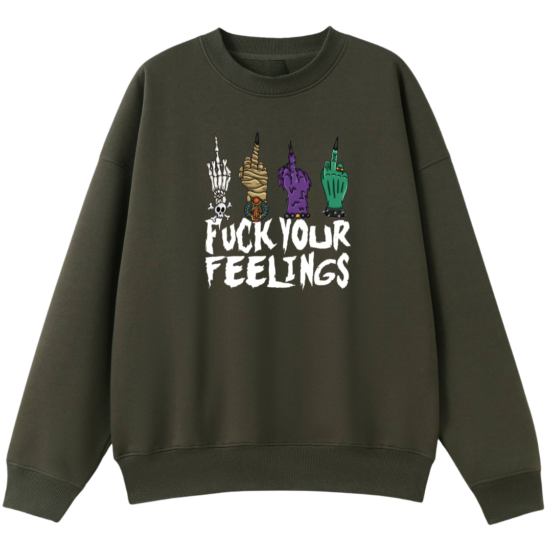 An army green oversized crew neck with the Fuck Your Feelings graphic printed large on the front, skeleton, mummy, werewolf and witch hands flipping the bird.