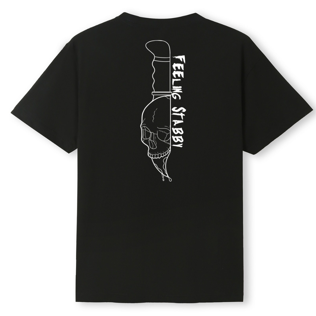 A black oversized tee shown from the back, with the Feeling Stabby graphic printed large across the back, a line drawn skull on a knife blade.