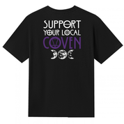 A black V neck oversized tee shown from the back, with the Support Your Local Coven graphic printed large across the back, purple lettering above a triple moon.