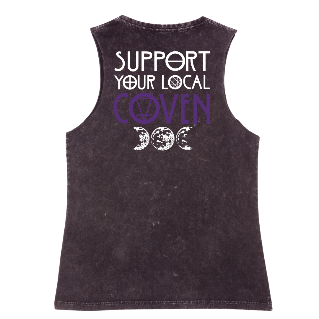 A black stone washed tank shown from the back, with the Support Your Local Coven graphic printed large across the back, purple lettering above a triple moon.