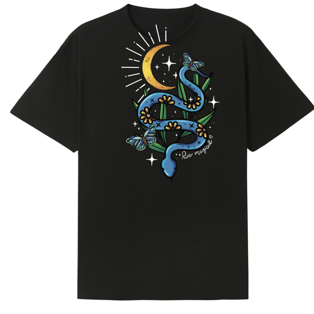 A black oversized tee shown from the back, with the Be Magic snake graphic printed large across the back, a blue floral snake with butterflies under a crescent moon.