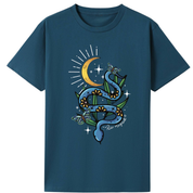 A teal oversized tee with the Be Magic snake graphic printed large on the front, a blue floral snake with butterflies under a crescent moon.