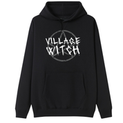 A black oversized hoodie with the Village Witch graphic printed large on the front, scratchy lettering over a weathered pentagram.