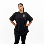 Woman wearing Namaste oversized black graphic tee plus size Australian streetwear brand Bae Bands