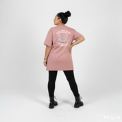 Woman wearing Inner Peace straight fit dusty pink graphic tee Australian plus size streetwear Bae Bands
