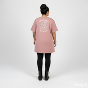 Woman wearing Surviving straight fit dusty pink graphic tee Australian plus size streetwear Bae Bands