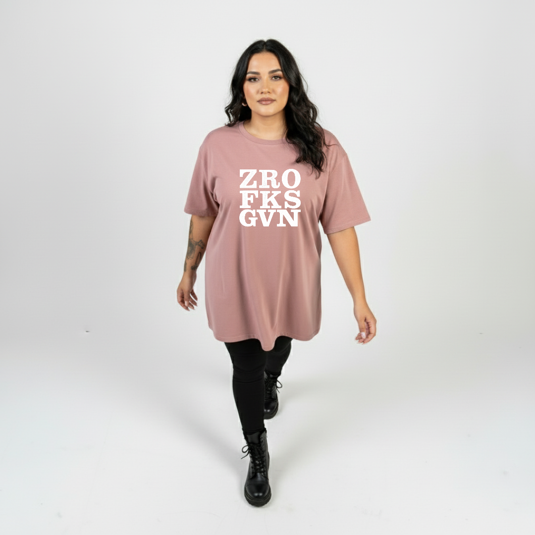 Woman wearing Zero Fucks straight fit dusty pink graphic tee Australian plus size streetwear Bae Bands