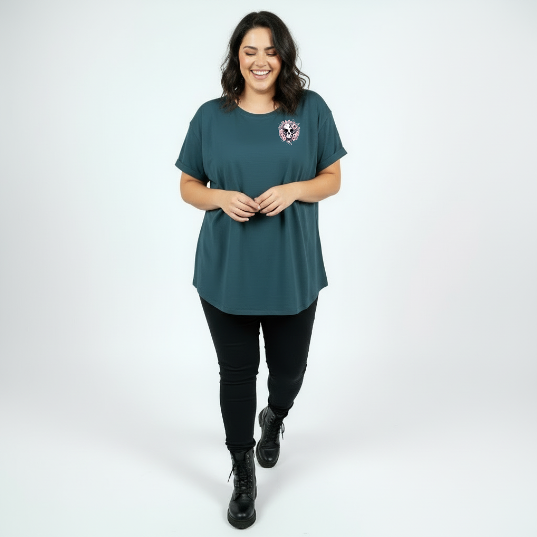 Woman wearing Roses and Bones skull graphic teal tee Australian plus size streetwear Bae Bands