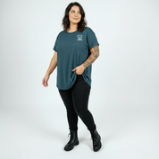 Woman wearing Surviving straight fit teal graphic tee Australian plus size streetwear Bae Bands