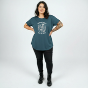 Woman wearing Surviving straight fit teal graphic tee Australian plus size streetwear Bae Bands