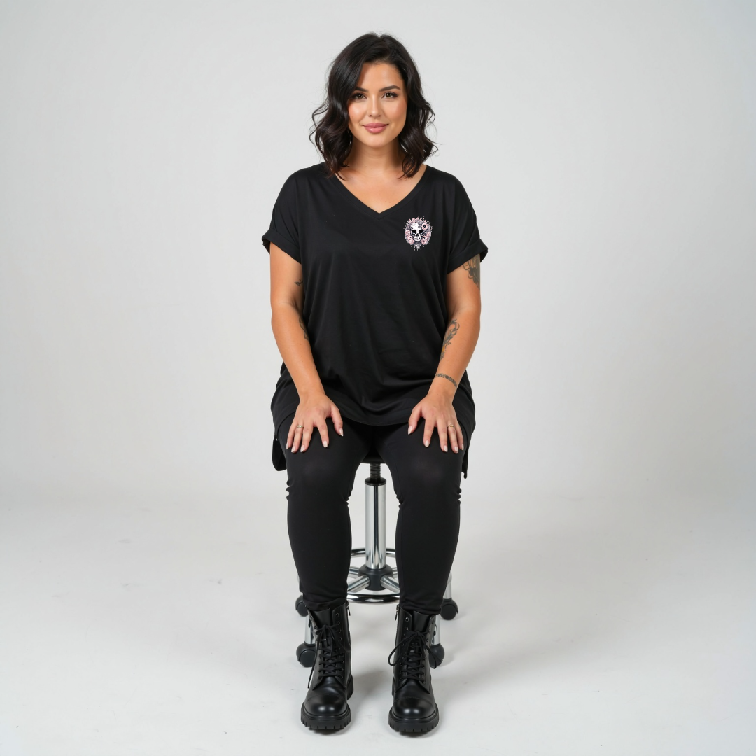 Woman wearing Roses and Bones skull graphic oversized black V neck tee plus size Australian streetwear brand Bae Bands