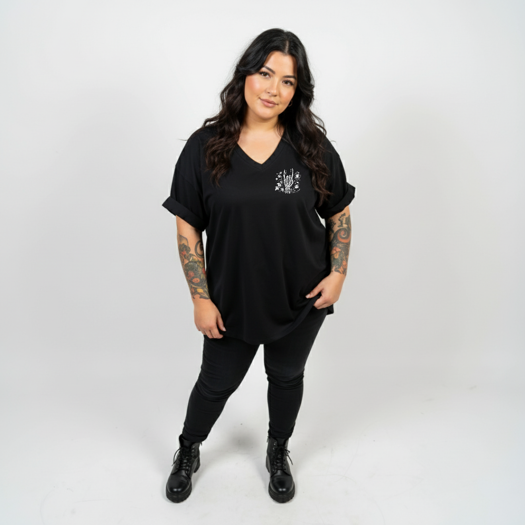 Woman wearing Inner Peace oversized black V neck graphic tee plus size Australian streetwear brand Bae Bands